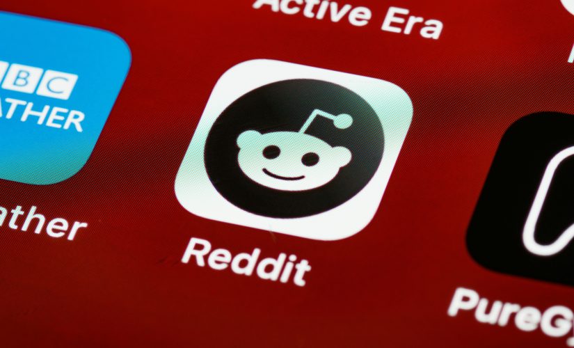 Reddit icon on a smartphone screen. Reddit is reportedly set to launch an IPO in March.