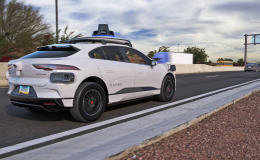 Waymo tests self-driving cars on Phoenix highways. White car seen on the road